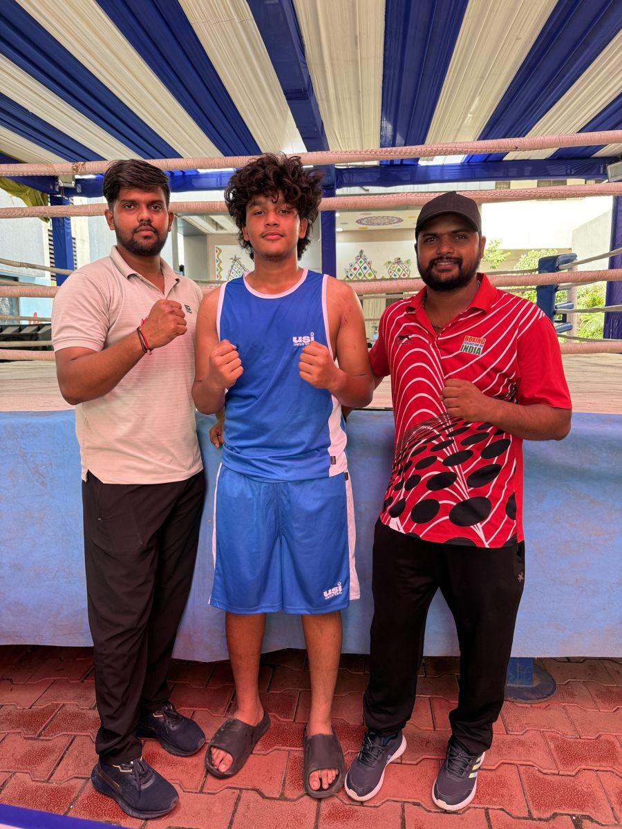 Utkarsh Chandel in blue with his coaches after winning State gold